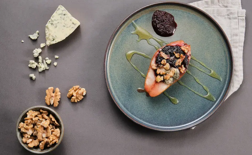 Pear with cherry and rhubarb spread, blue cheese, and walnuts