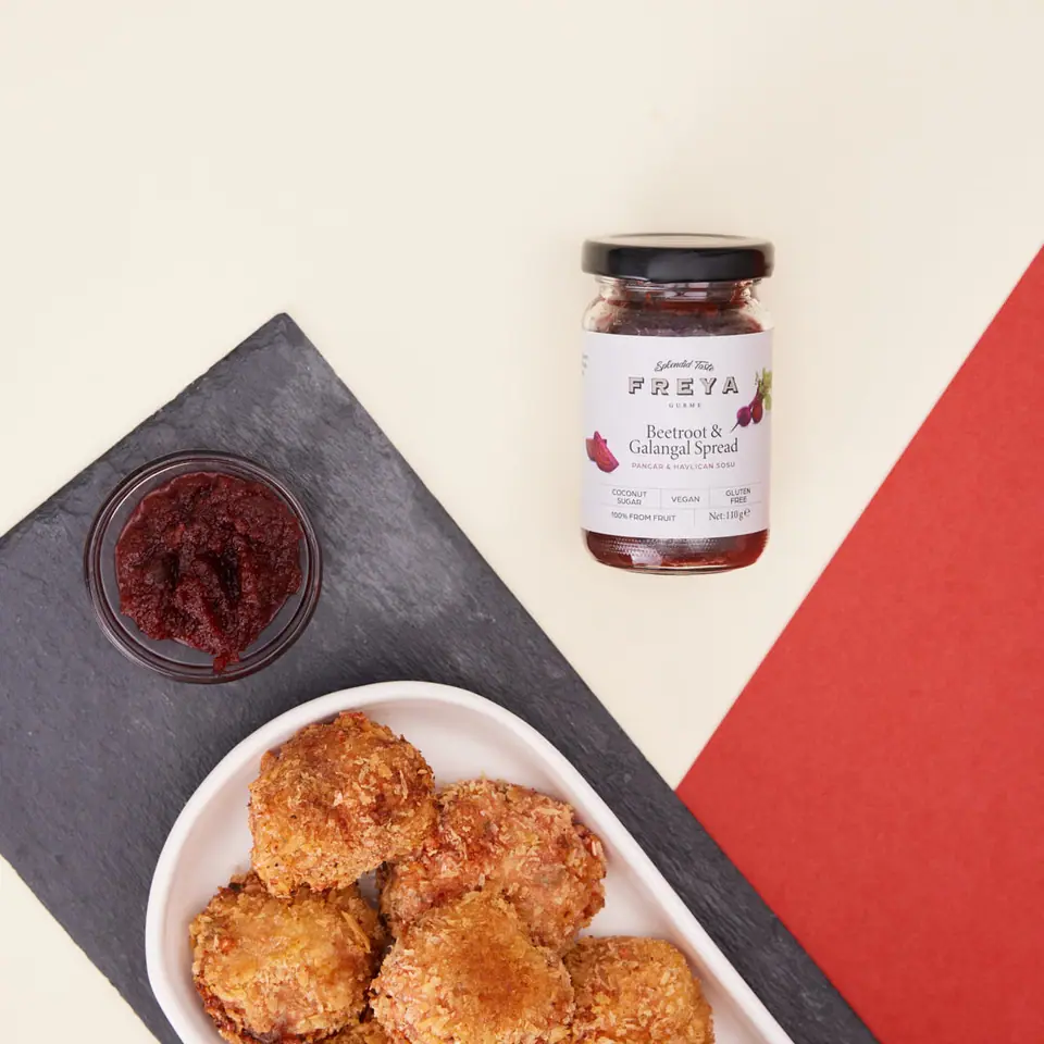 Golden cauliflower bites served with beet and galangal spread
